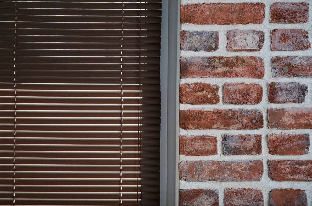 window with brown blinds brick wall made old bricks loft interior industrial interior as background closeup